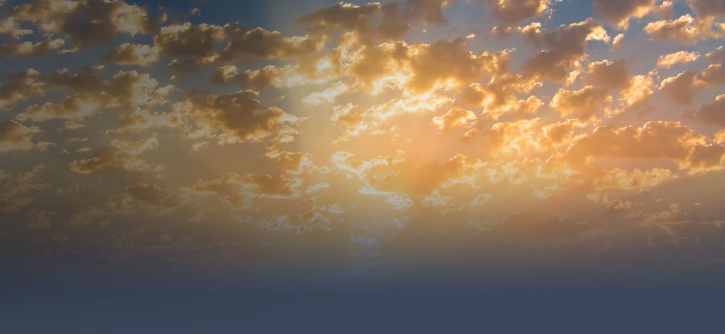 Bright yellow orange clouds in sky
